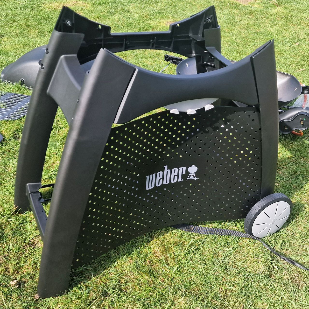 The Weber Q3200 BBQ being assembled