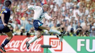 LONDON, ENGLAND - JUNE 15: England player Paul Gascoigne shoots to score the second England goal during the 1996 European Championships Group match against Scotland at Wembley Stadium on June 15, 1996 in London, United Kingdom. (Photo by Stu Forster/Allsport/Getty Images/Hulton Archive)