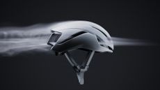The Specialized S-Works Evade 4, with fog flowing through its vents from front to back of the helmet to depict its new 2.4% increase in ventilation improvement. 