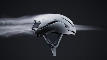 The Specialized S-Works Evade 4, with fog flowing through its vents from front to back of the helmet to depict its new 2.4% increase in ventilation improvement. 