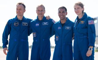 Soon to be no. 600 in space, ESA astronaut Matthias Maurer (at left), poses with NASA astronaut Tom Marshburn, who was almost no. 500 in 2009, and SpaceX Crew-3 crewmates Raja Chari and Kayla Barron after arriving for launch at NASA's Kennedy Space Center in Florida on Tuesday, Oct. 26, 2021.