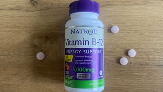 Natrol B12 pills and container laid on a table
