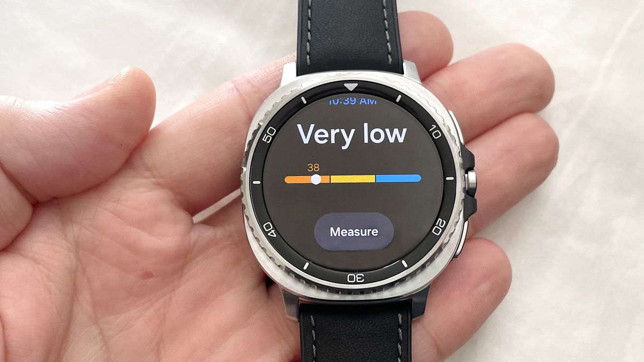 Close-up of the Samsung Galaxy Watch 8 Classic in silver on a black strap showing the Antioxidant testing feature with a rating of "very low"