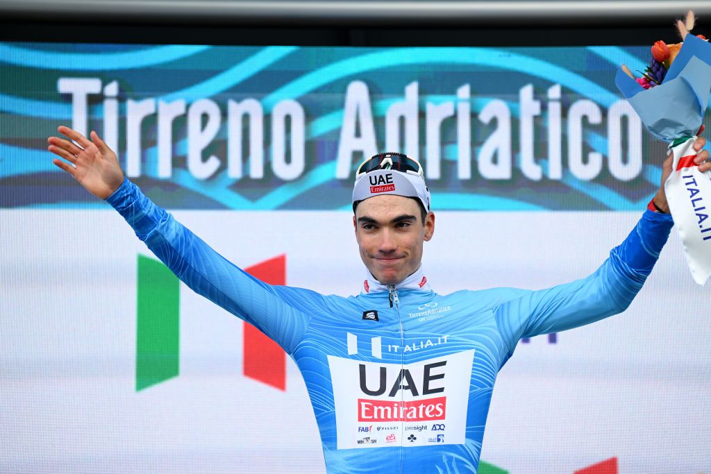 LIDO DI CAMAIORE ITALY MARCH 04 Juan Ayuso of Spain and UAE Emirates Team celebrates at podium as Blue Leader Jersey winner during the 59th TirrenoAdriatico 2024 Stage 1 a 10km individual trial time from Lido di Camaiore to Lido di Camaiore UCIWT on March 04 2024 in Lido di Camaiore Italy Photo by Tim de WaeleGetty Images