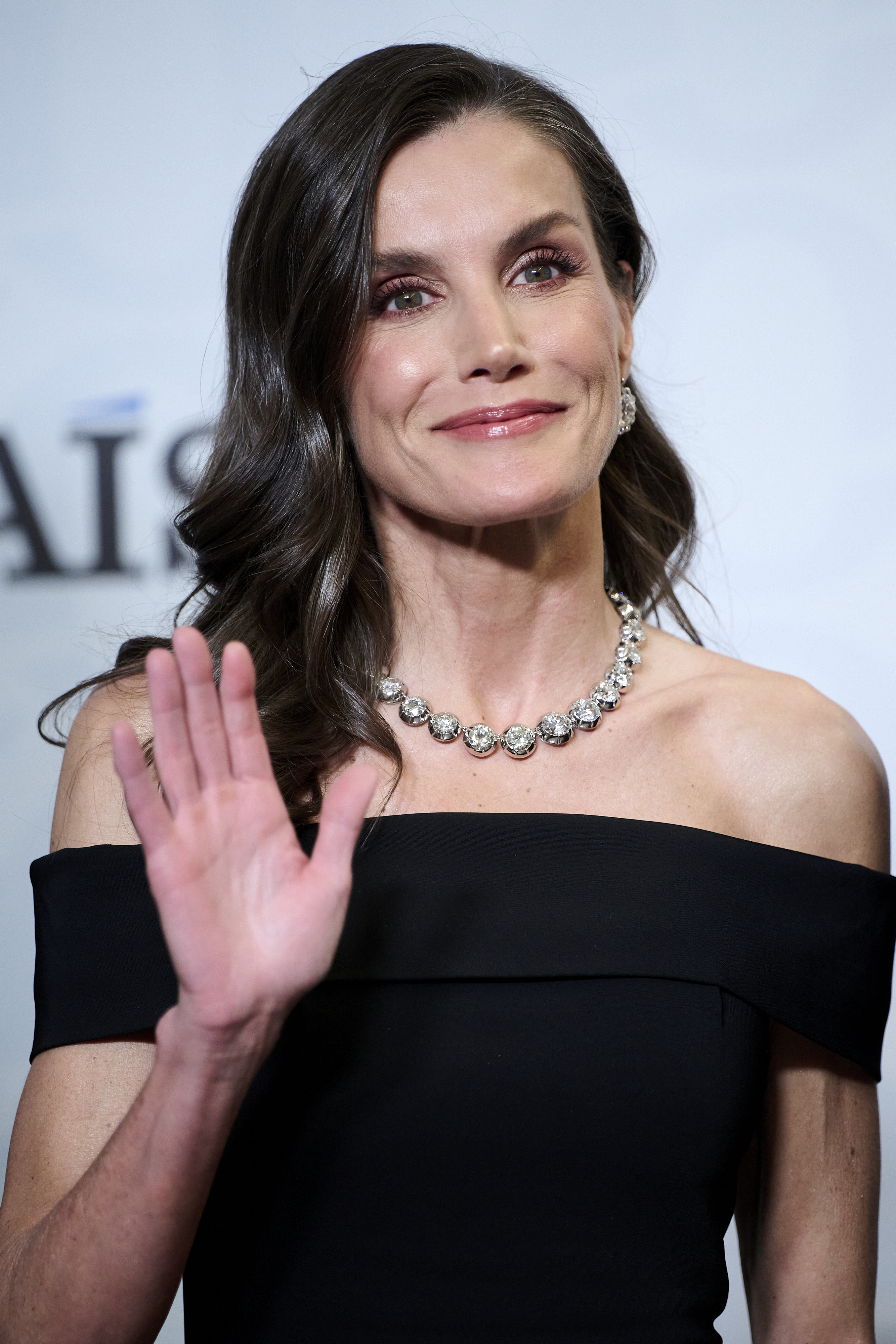 Queen Letizia wearing a black dress and a diamond necklace