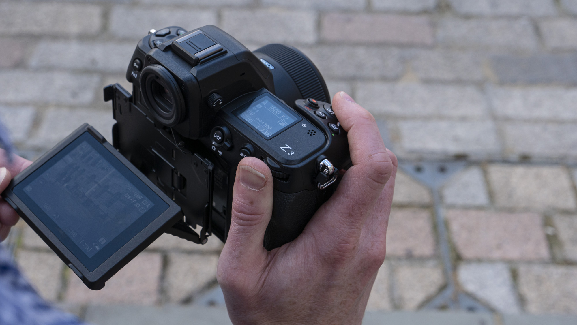Nikon Z8 camera in the hand with 4-axis screen pulled out