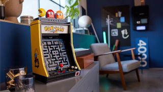 Lego Pac-Man Arcade set sat on a shelf beside a chair