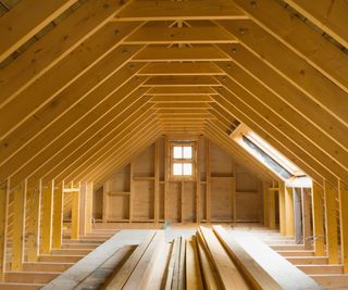 A wooden attic structure exposed