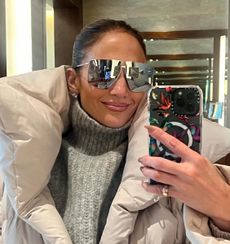 Jennifer Lopez wears a gray puffer coat while in Japan 2024