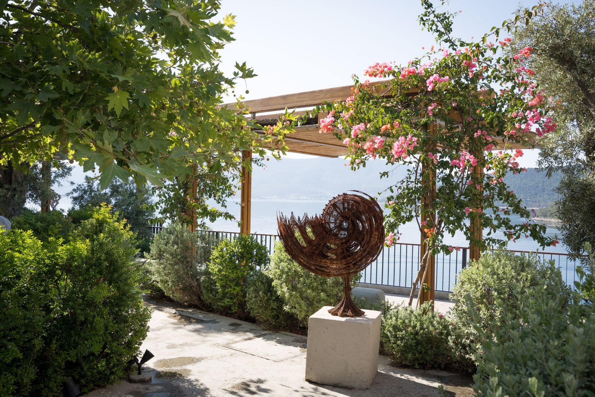 Wim Delvoye sculpture on planted terrace at Bodrum Loft / Perrotin exhibition