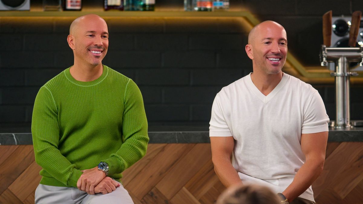 Brett Oppenheim and Jason Oppenheim sitting together in Selling the OC season 2