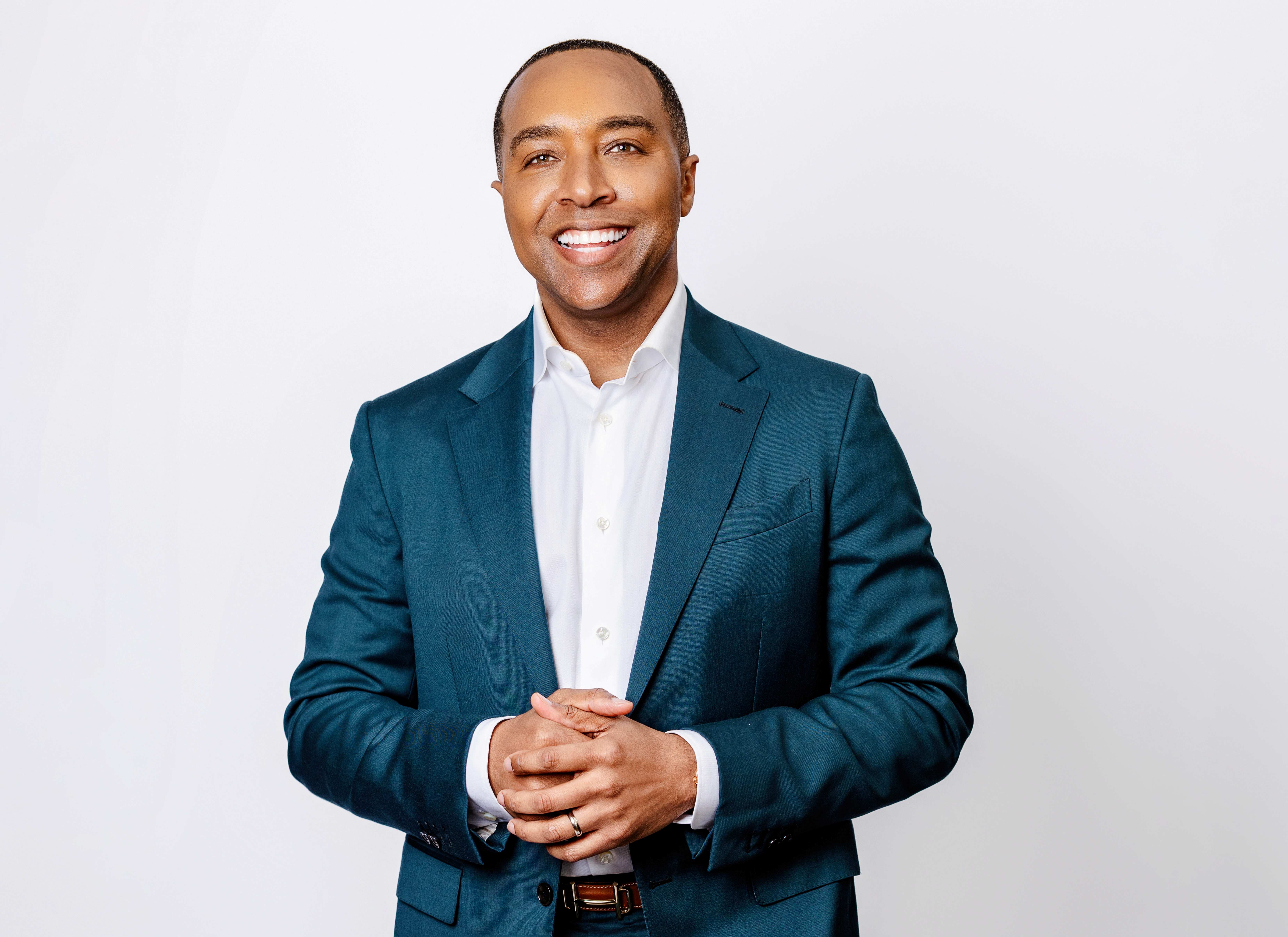 Dr. Corey L. Hartman in a blue suit