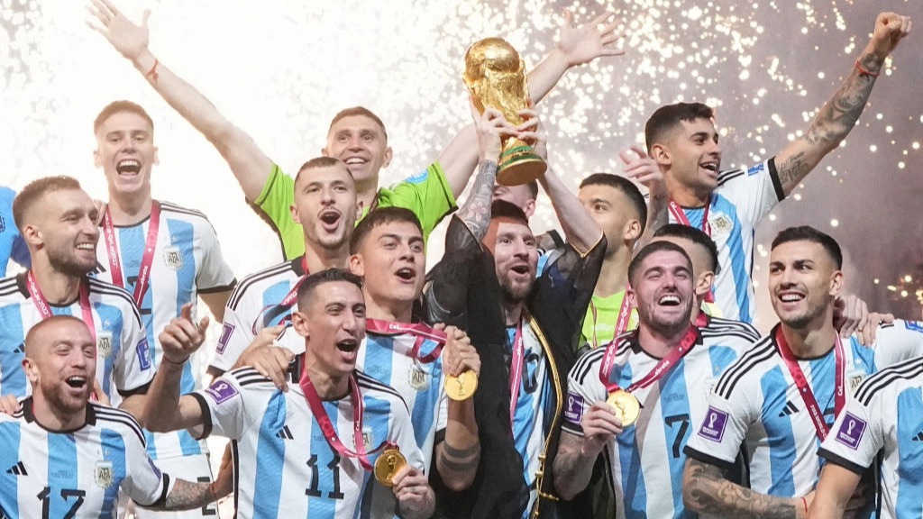Lionel Messi lifts the World Cup trophy after Argentina beat France in the final