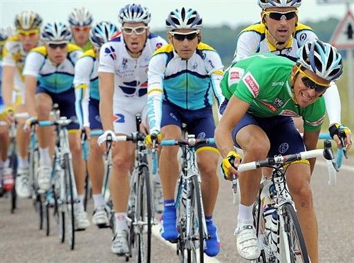 Alberto Contador (Astana) in green scratches an itch during the second stage.