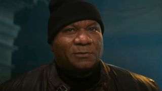 Ving Rhames smiles as he stands in a safe house in Mission: Impossible - Dead Reckoning Part One.