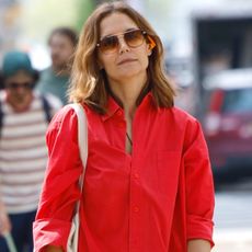 Katie Holmes wore the high-vamp flats trend with the strawberry red and sky blue color combination for spring