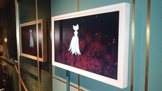 Tokenframe; a photo of an NFT display on a restaurant wall
