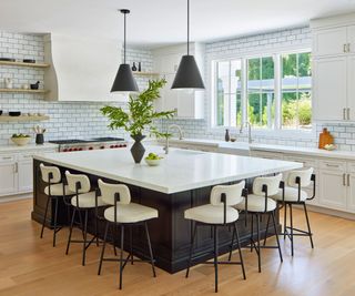 kitchen with white tiles and black island