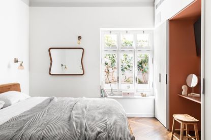 a bedroom with a vanity in a wardrobe