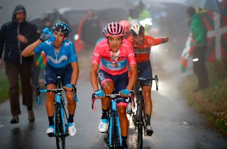 Richard Carapaz rides through the fog on the Mortirolo climb during stage 16