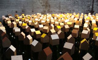 'Bottle Houses' sits atop vessels on the floor at Kazerne