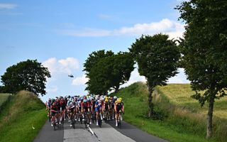 The pack of riders cycles during the 3rd stage of the 109th edition of the Tour de France cycling race 182 km between Vejle and Sonderborg in Denmark on July 3 2022 Photo by AnneChristine POUJOULAT AFP Photo by ANNECHRISTINE POUJOULATAFP via Getty Images
