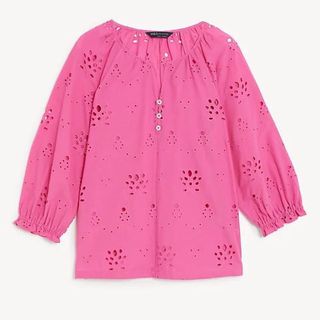 flat lay of pink m&s broderie blouse