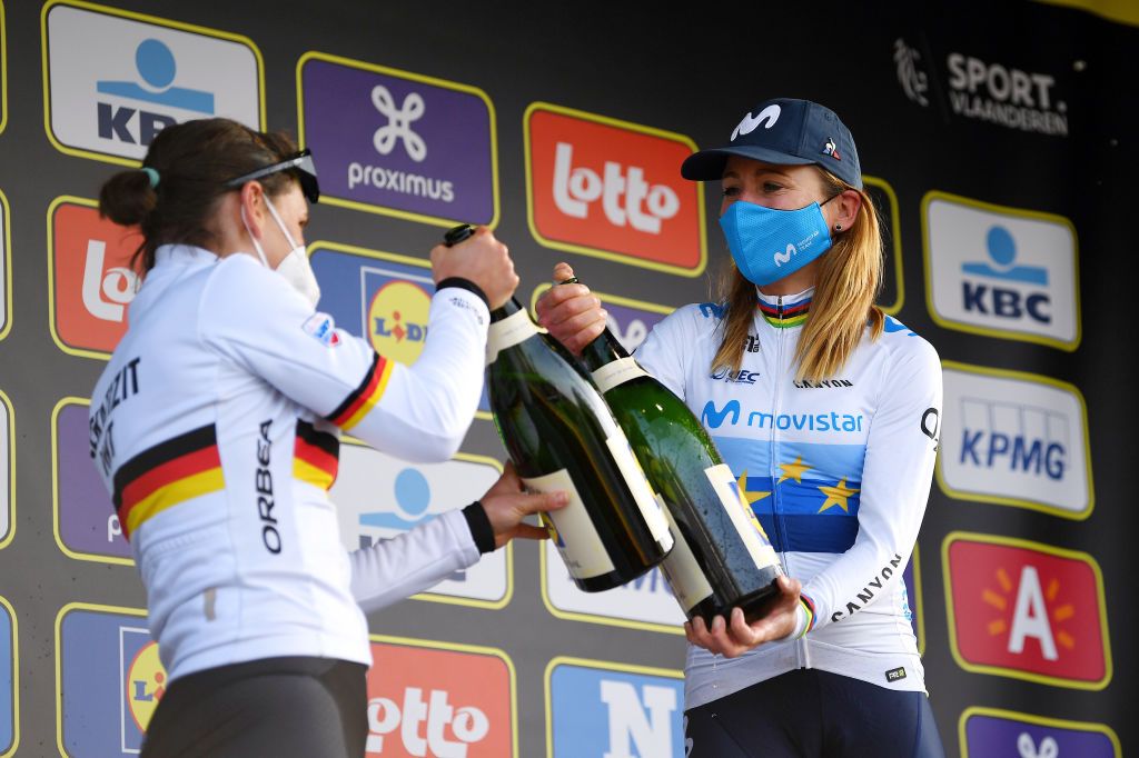 OUDENAARDE BELGIUM APRIL 04 Podium Lisa Brennauer of Germany and Ceratizit WNT Pro Cycling Team Annemiek Van Vleuten of Netherlands and Movistar Team Women Celebration during the 18th Ronde van Vlaanderen Tour of Flanders 2021 Womens Elite a 1524km race frim Oudenaarde to Oudenaarde Champagne Mask Covid Safety Measures RVV21 rondevanvlaanderen tourofflanders UCIWWT on April 04 2021 in Oudenaarde Belgium Photo by Tim de WaeleGetty Images