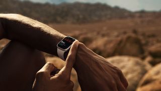 Apple Watch Series 7 on someone's wrist while sitting outdoors