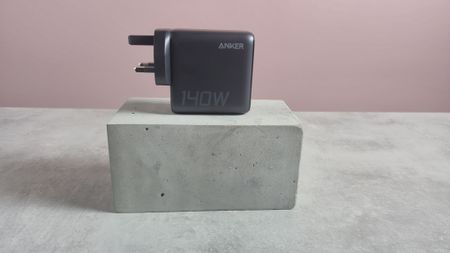 Anker Charger 140W, 4-Port, PD 3.1 on block against pink background