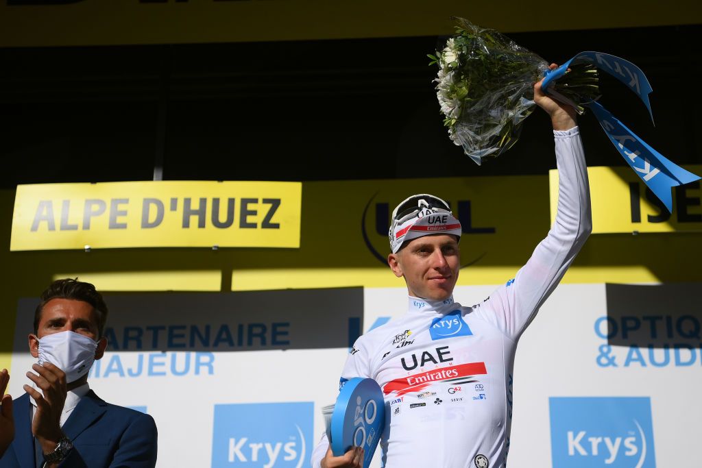 ALPE DHUEZ FRANCE JULY 14 Tadej Pogacar of Slovenia and UAE Team Emirates celebrates winning the white best young jersey on the podium ceremony after the 109th Tour de France 2022 Stage 12 a 1651km stage from Brianon to LAlpe dHuez 1471m TDF2022 WorldTour on July 14 2022 in Alpe dHuez France Photo by Alex BroadwayGetty Images