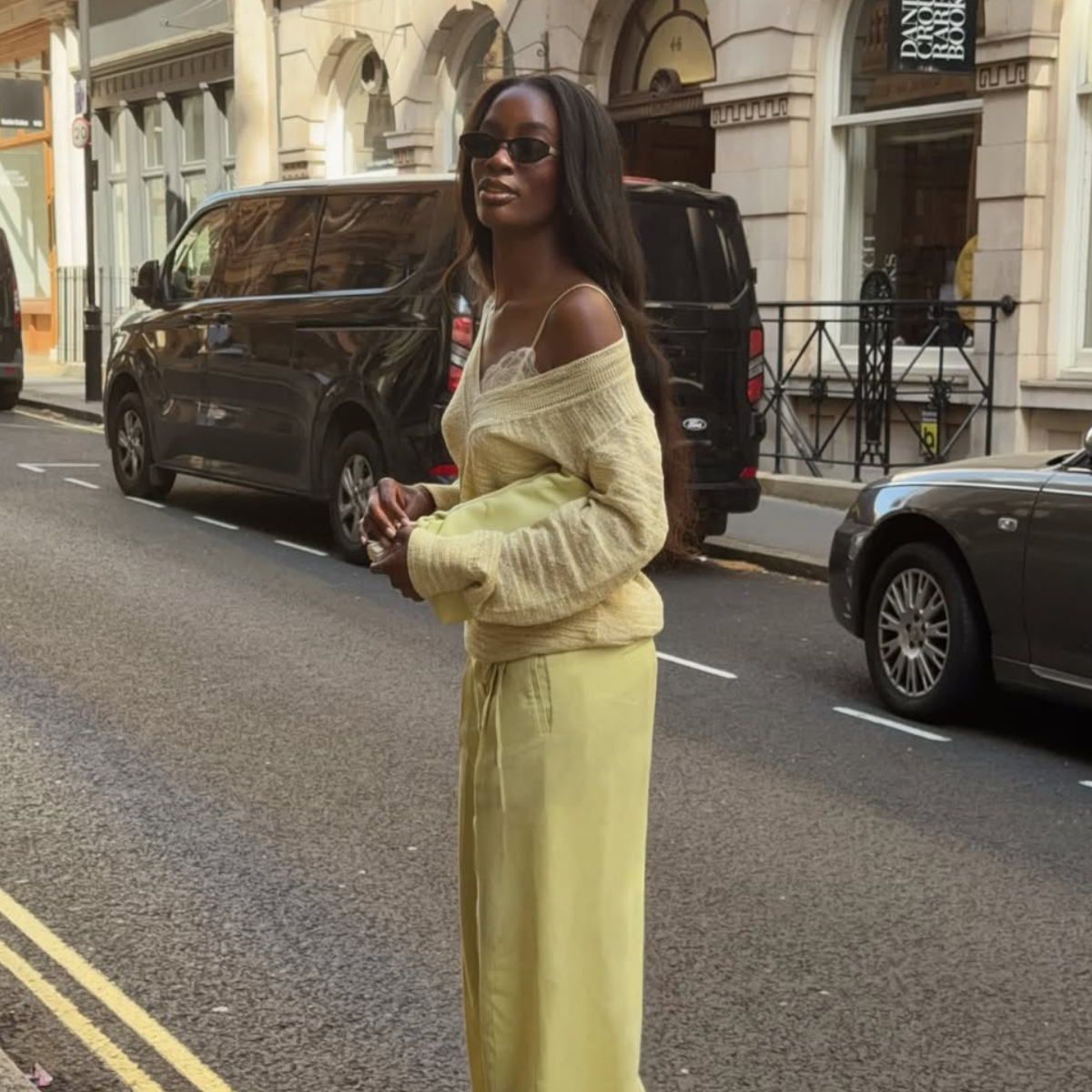Liv in yellow outfit and lace bralette