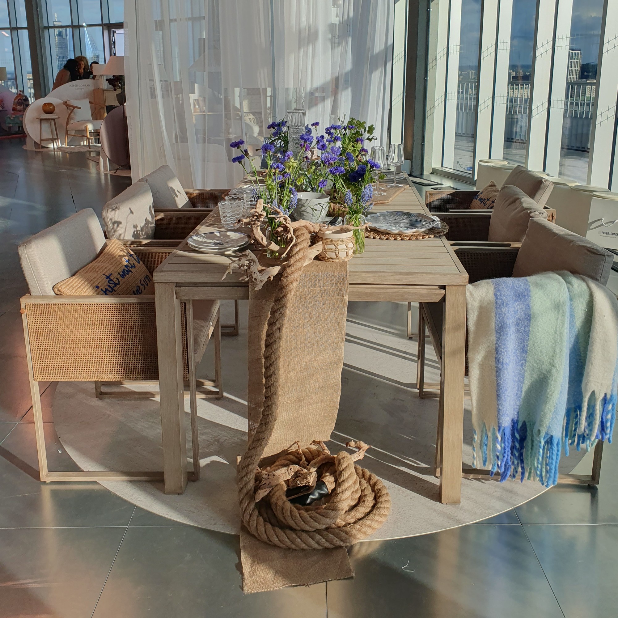 The Abel outdoor dining set made with wood and rattan at the Next spring/summer 2025 press showcase