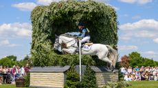 Lara de Liedekerke-Meier and Hooney D&rsquo;Arville jump a cross-country fence at Badminton Horse Trials 2025.