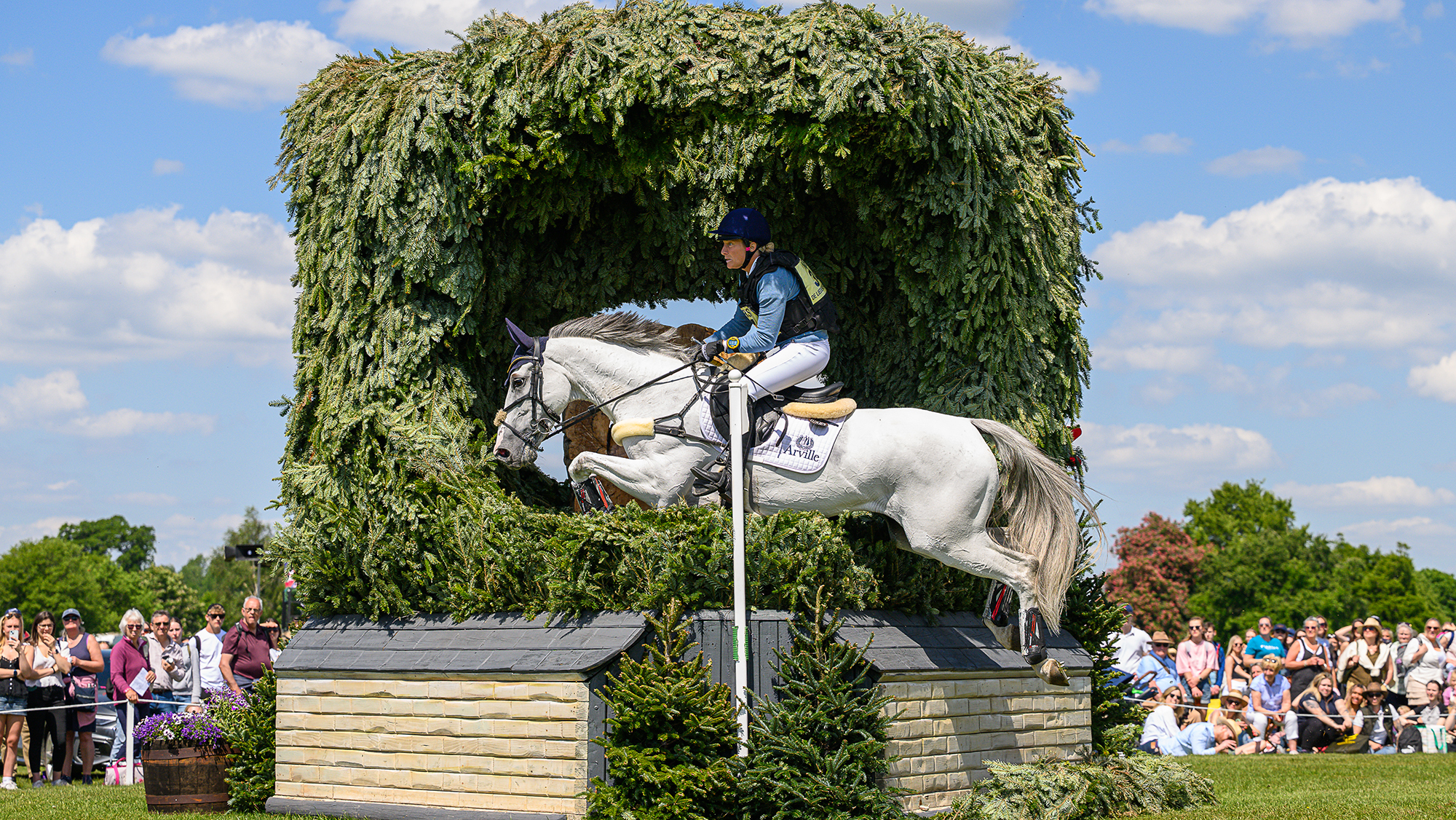 Lara de Liedekerke-Meier and Hooney D&rsquo;Arville jump a cross-country fence at Badminton Horse Trials 2025.