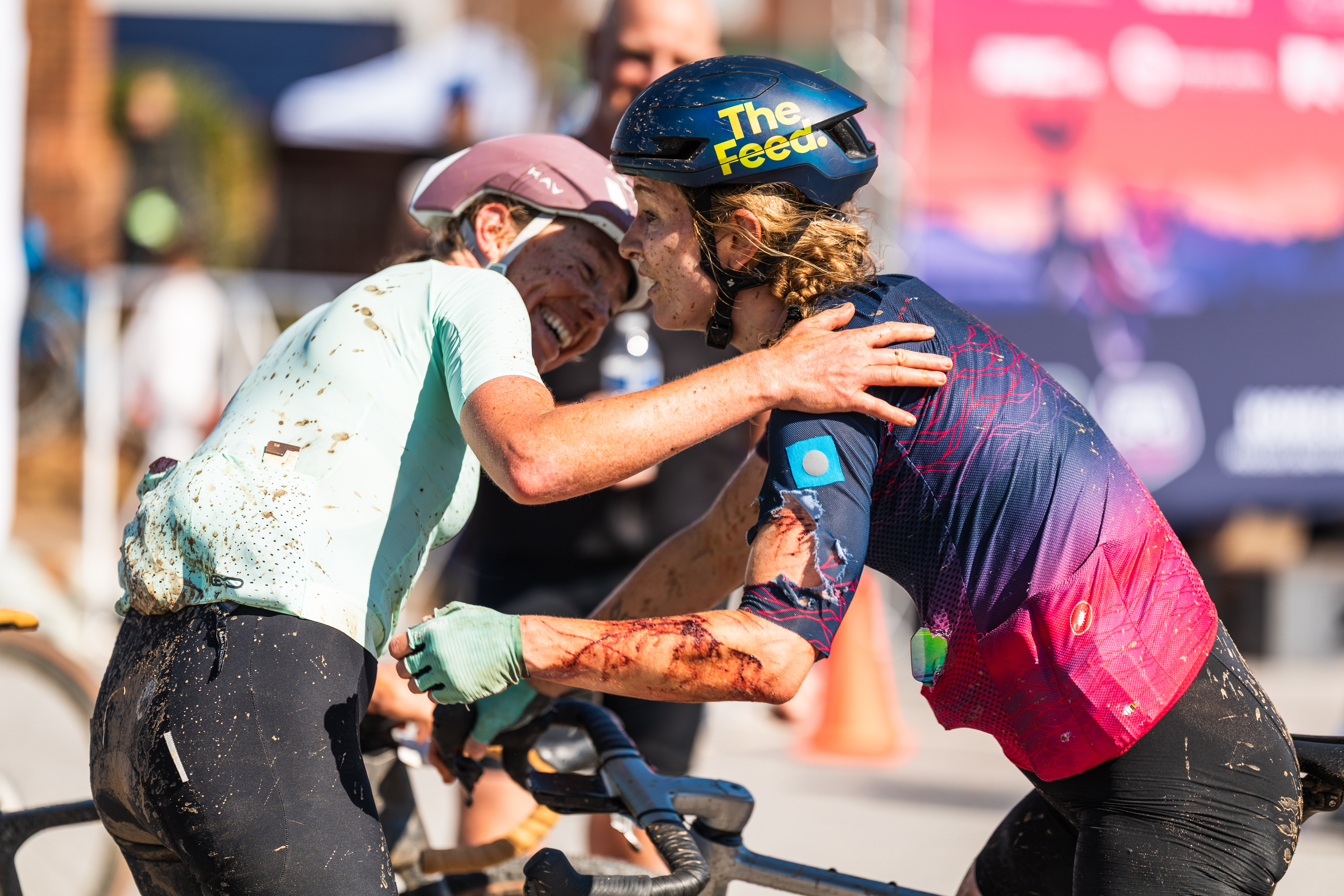 2026 winner Emily Newsom (left) gets a hug from defending champion Lauren De Crescenzo (right), who finished runner-up after struggling with injuries suffered in collision with barbed wire fence