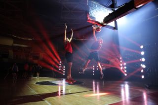 Canon EOS R5 Mark II sample image: basketball players playing a pickup game, backlit with laser lighting