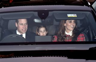 Prince William wears a suit and tie while driving Kate Middleton, who wears a tartan outfit, to Buckingham Palace in 2019