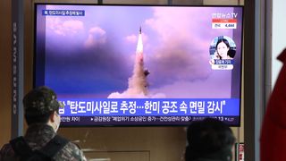 People watch a North Korean missile launch on a television at the Seoul Railway Station in Seoul, South Korea, on Jan. 5, 2022.