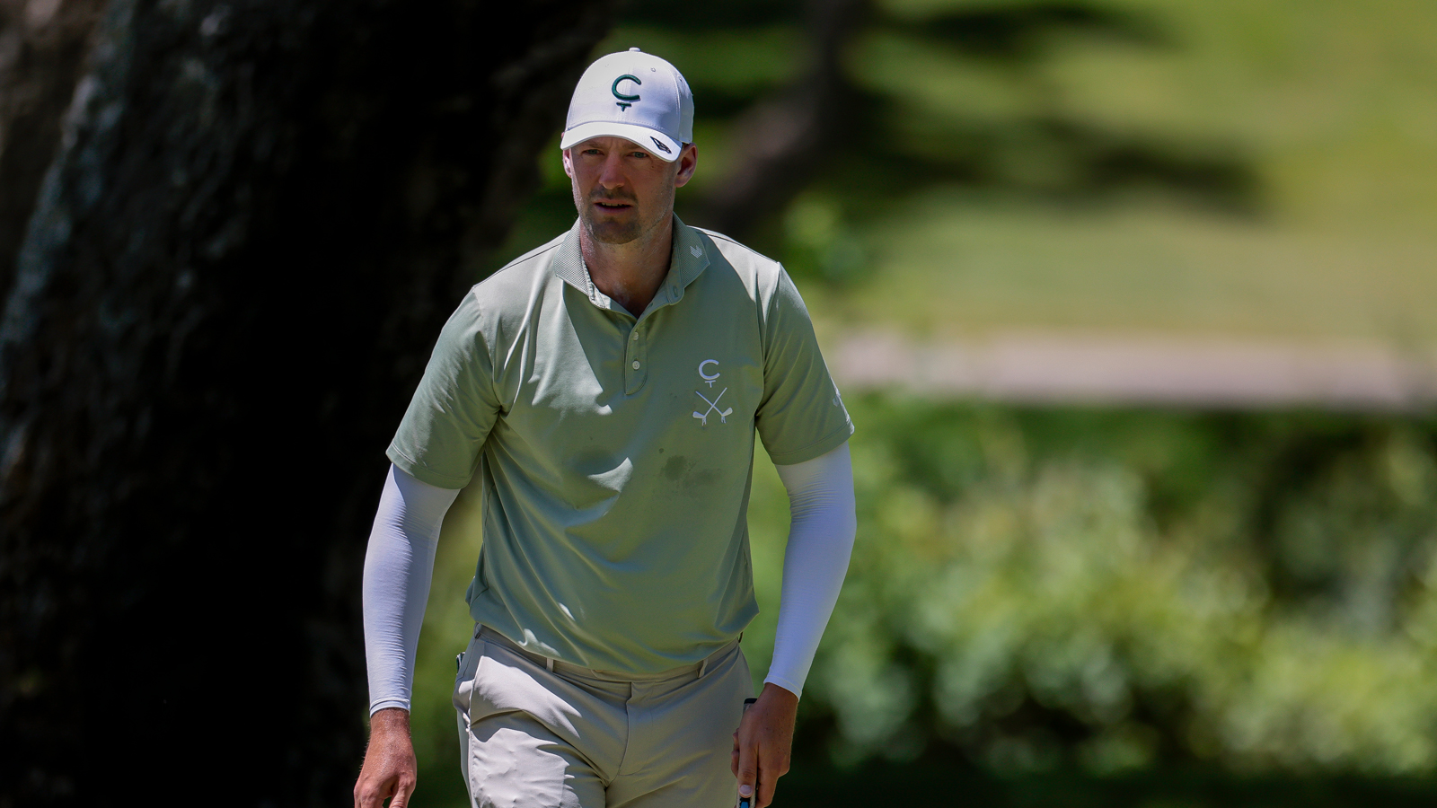 Victor Perez walks off the green