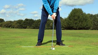 Clive Tucker demonstrates the correct ball position with an iron to minimise the chance of fat or thin strikes