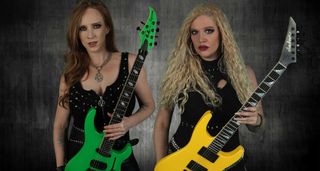 Courtney Cox and Romana Kalkuhl of Burning Witches. Cox holds her slime green Caparison, while Kalkuhl has a yellow Jackson Soloist.