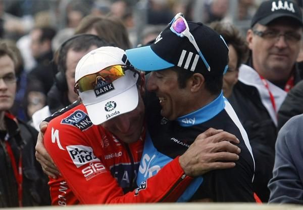 Winner Fabian Cancellara (Saxo Bank) is congratulated by third place finisher Juan Antonio Flecha (Sky).