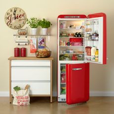 fridge with wooden flooring and drawers