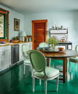 kitchen diner with green gloss floor