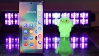 Samsung Galaxy S25 Edge showing the Samsung Edge Panel with black lights and an Android figurine blurred in the background