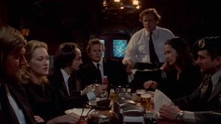 Meryl Streep gathers around a bar table at the end of The Deer Hunter