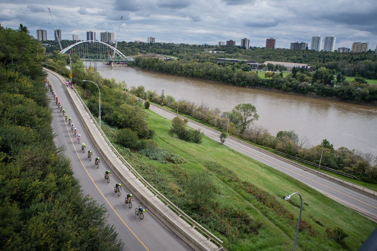 Riders descend to the river before hitting one of todays climbs