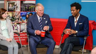 King Charles most memorable moments - Princes Trust center, Prince Charles laughs at him receiving two spoons in his tea