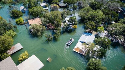 An aerial view of houses flooded after a storm.